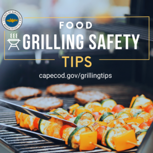 Image of burgers and kabobs on a grill. Over the image is text, "Food Grilling Safety Tips" with the link www.capecod.goc/grillingtips.