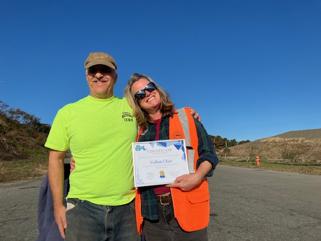 Kalliope receiving the MassRecycle award from Philip Goddard, Manager of Facility Compliance and Technology Development , Town of Bourne, ISWM Department.